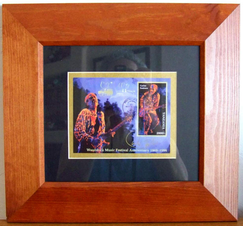 Carlos Santana Signed Woodstock Commemorative Stamp Pane as framed