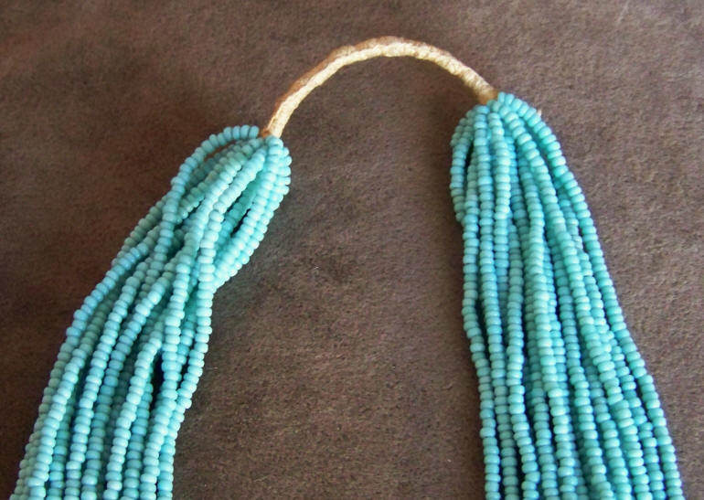 16 Strand Turquoise Colored Seed Bead Necklace close up